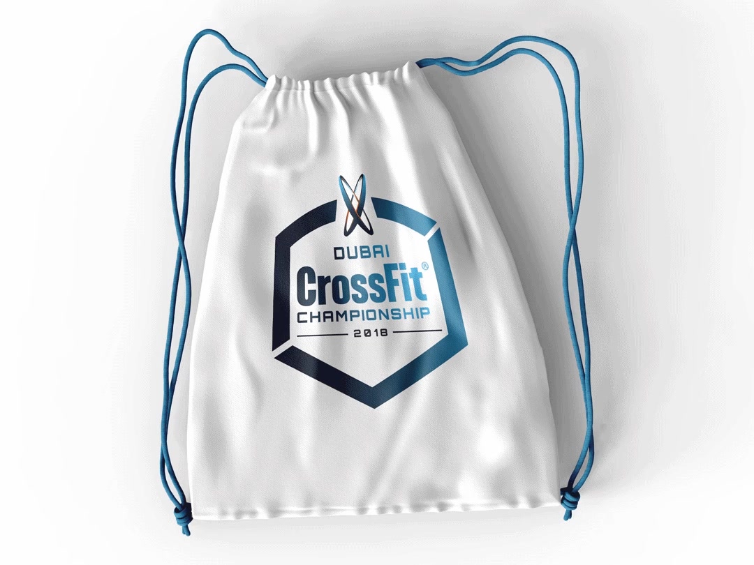 A white drawstring bag printed with the Dubai CrossFit Championship badge