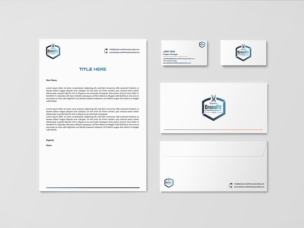 A letterhead, two business cards and two envelopes, each carrying the badge