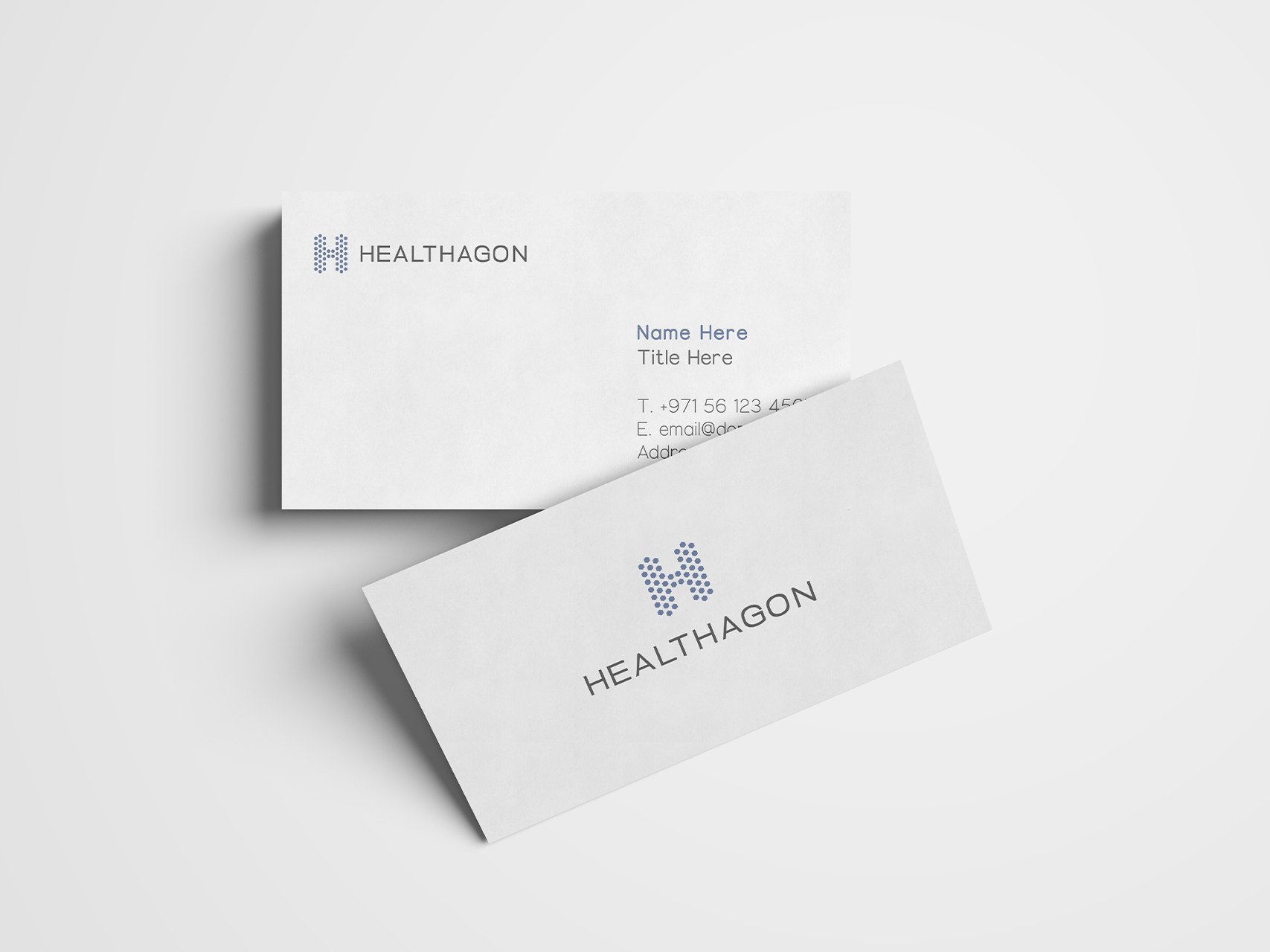 Two Healthagon business cards on pale grey, one with the logo