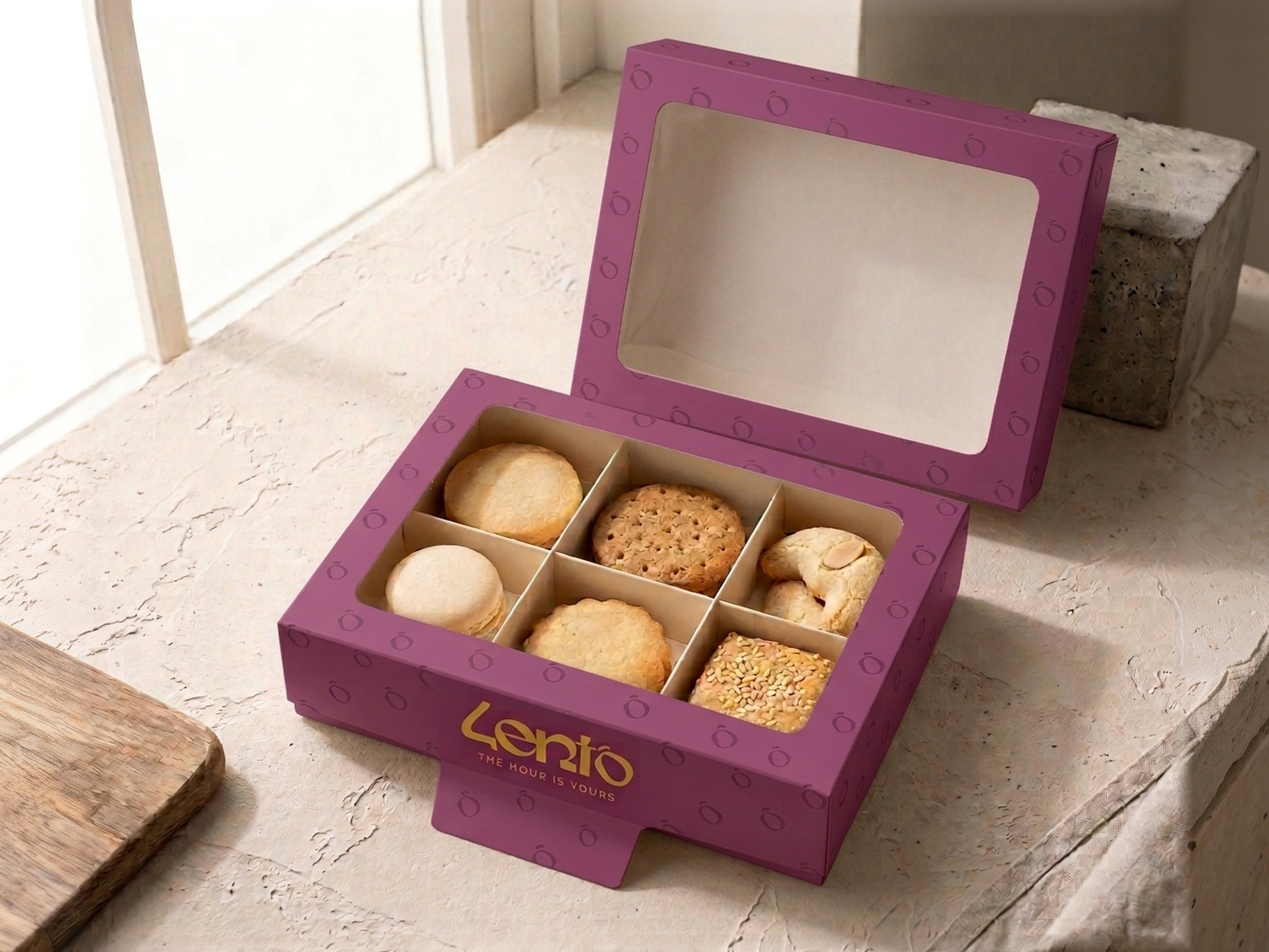 The plum Lento pastry box open, six pastries inside