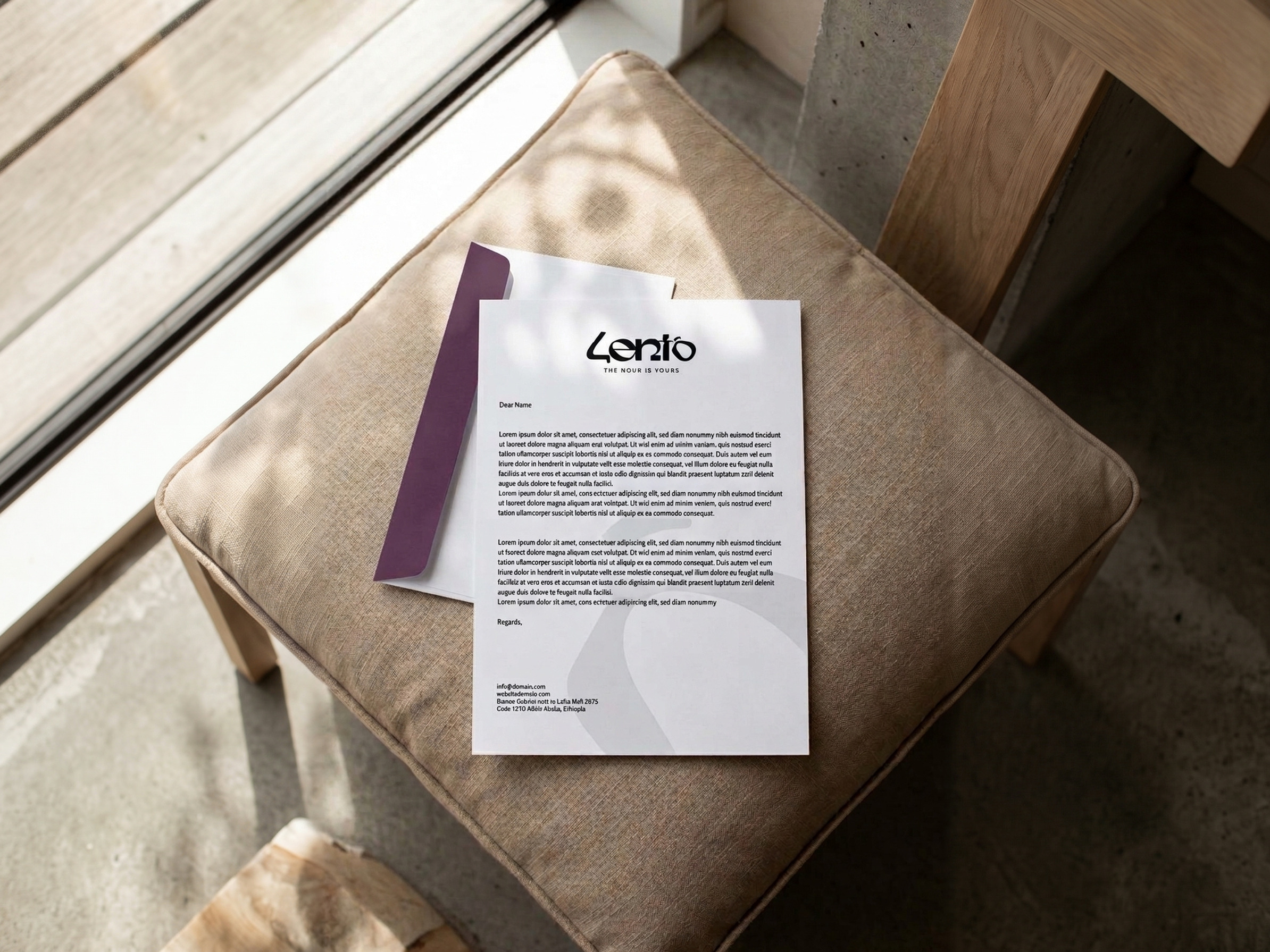 The Lento letterhead with a plum edge and the lockup at the head