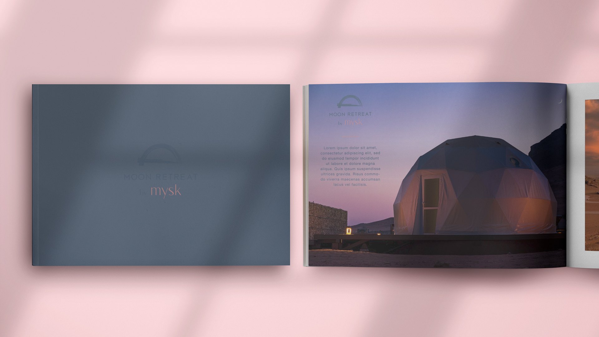 A slate blue brochure cover beside a spread showing a geodesic dome at dusk