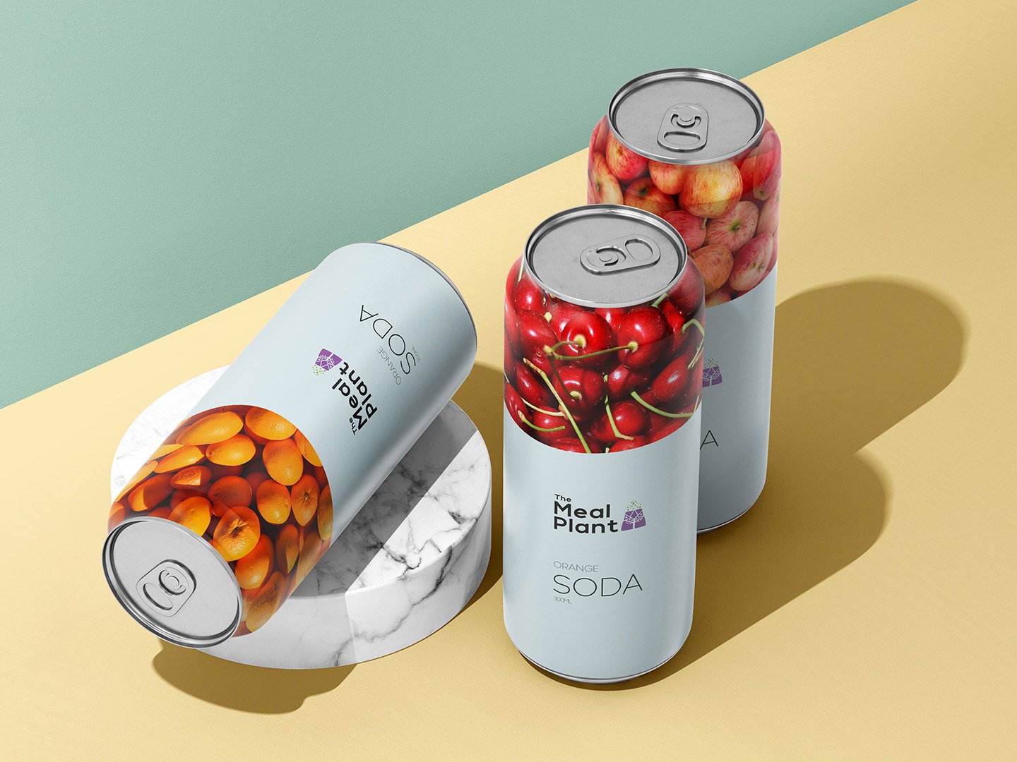 Three soda cans with oranges, cherries and apples, the logo in charcoal
