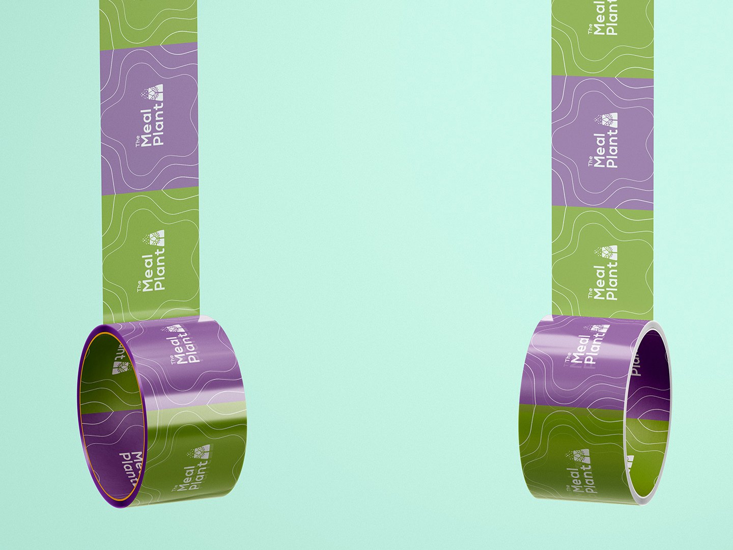 Two rolls of packing tape on mint, lilac and green tiles with white lines